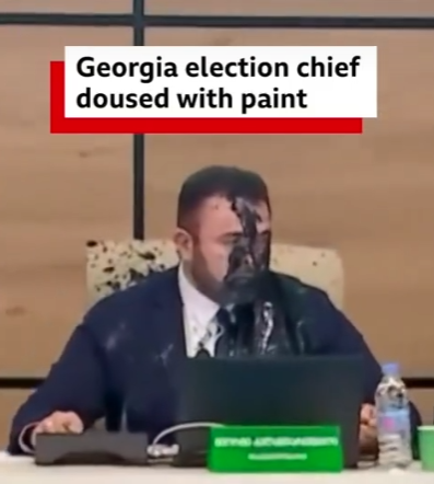 Chaos Erupts as Election Chief Is Suddenly Drenched in Black Paint During Live Meeting!