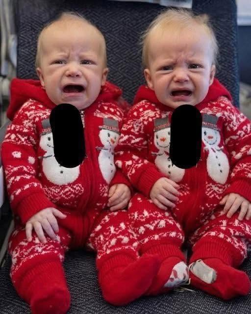 Young woman puts both babies inside the fir